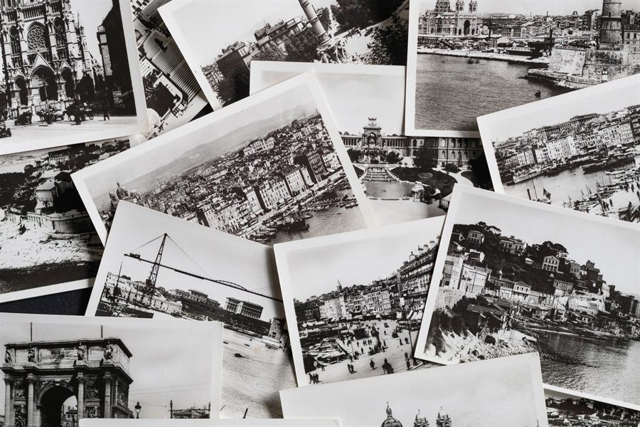 Spread of old black-and-white picture postcards
