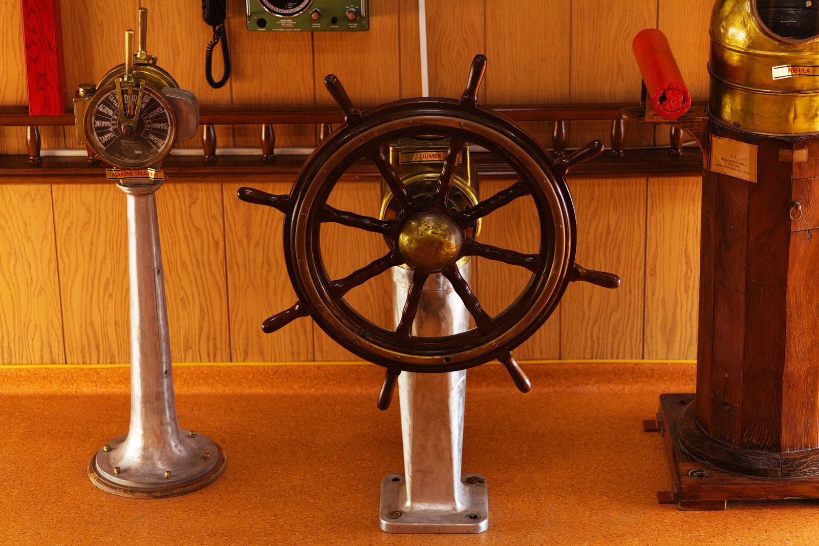 Historic ship&rsquo;s helm and brass fittings displayed in a maritime museum, the kind of cruise ship memorabilia collectors look for